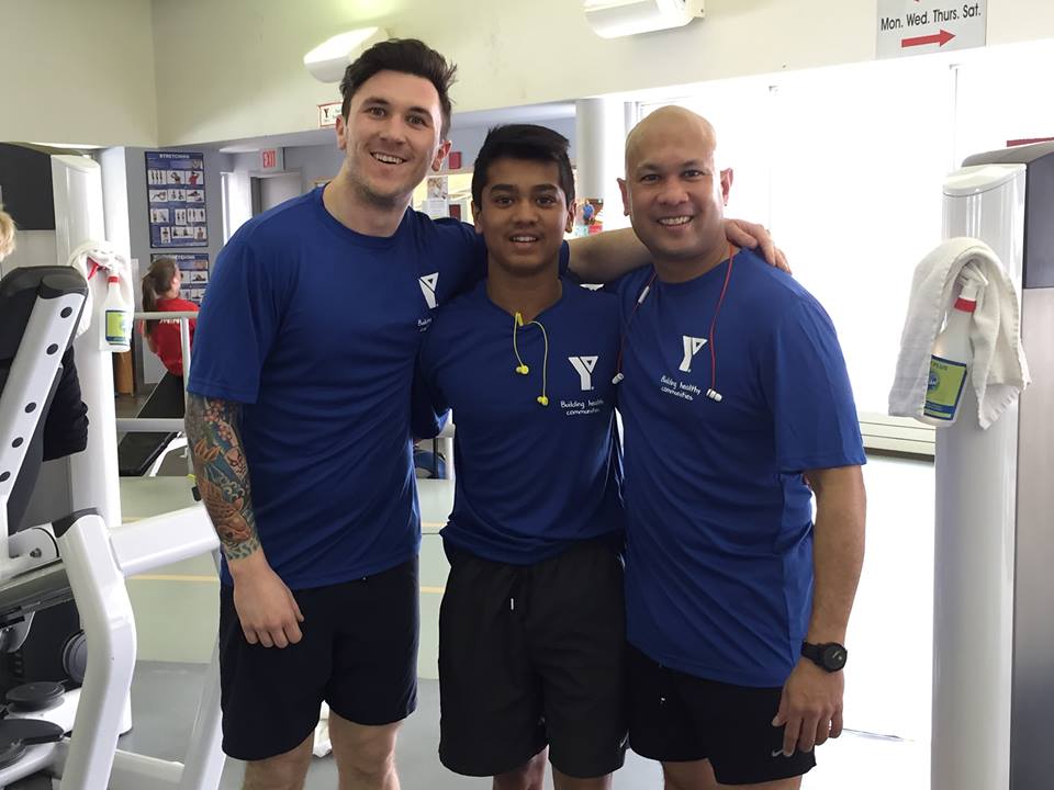 David with his son Malik and Kyle Cosby at the YMCA Megathon in March 2015.